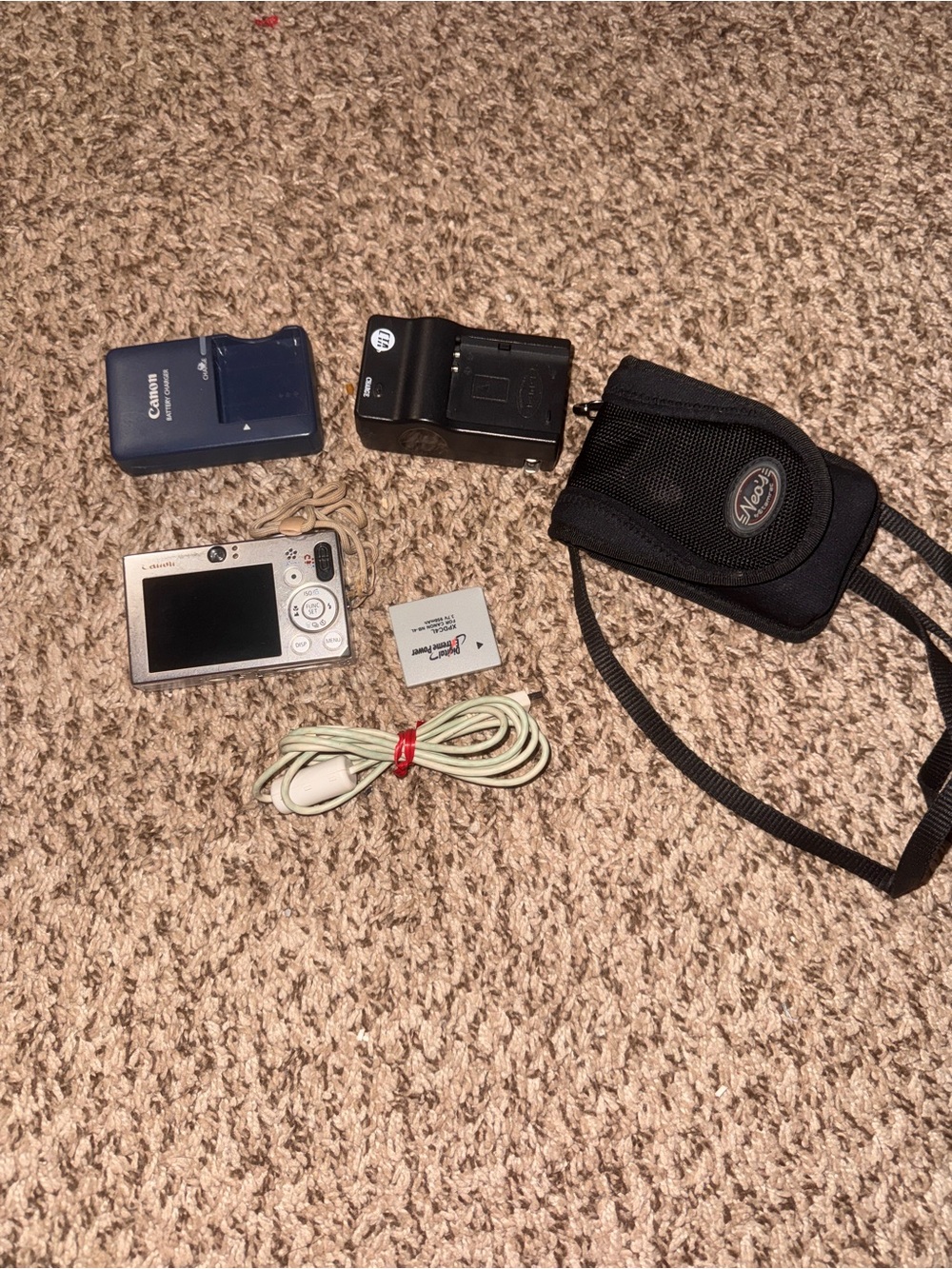 Canon Compact Silver Point-and-Shoot Camera with Black Case and Chargers
